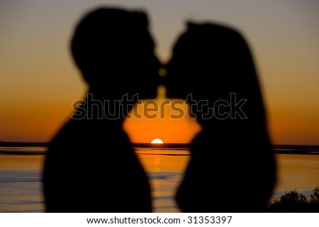 couple kissing sunset. stock photo : Couple Kissing