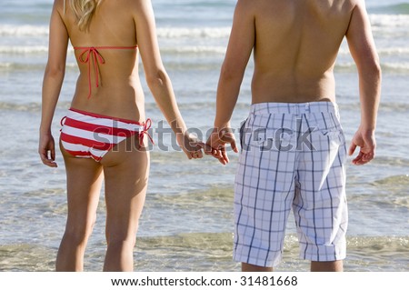 stock photo : A Couple Holding Hands on the Beach