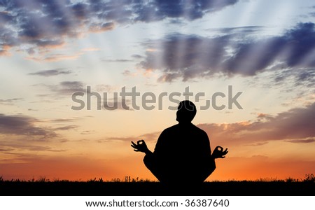 Silhouette of man in meditation