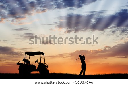 Silhouette of golfer and golf cart