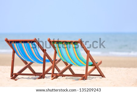 Colorful chairs on tropical beach