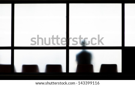 Man sitting alone in airport lobby