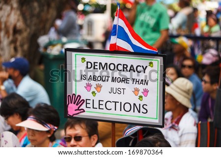 BANGKOK-DEC 22: Unidentified Thai protesters raise banners to resist government of Shinawatra regimes on Dec 22, 2013 in Bangkok, Thailand. It claims that up to million Thai people gather on such day.