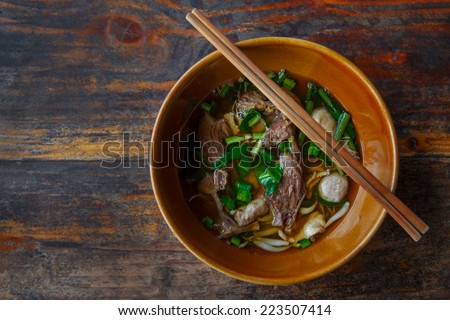 Chinese clear soup in traditional ceramic bowl