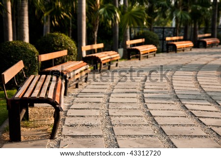 Bench in park at sunset