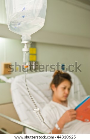 Female patient reading book in hospital