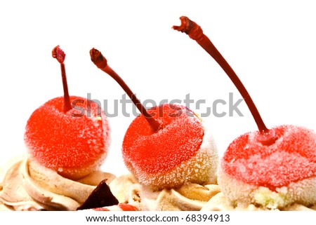 Red cherries on top of cake