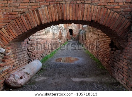 Ancient brick arch under the Roman theater in Taormina, Sicily, Italy