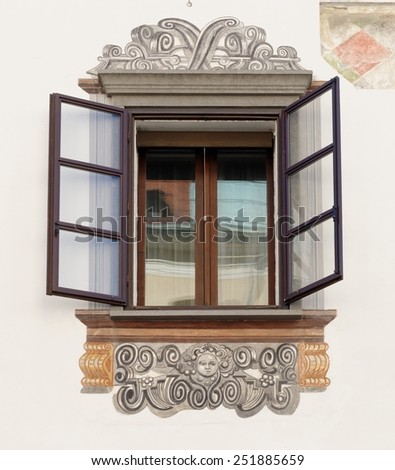Window of old house in Ljubljana, Slovenia, with murals