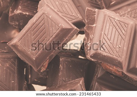 Pieces of milk chocolate closeup. Macro photo