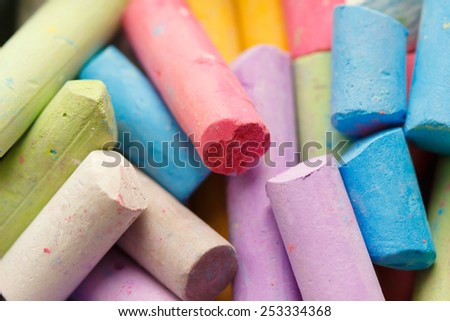 Colorful crayons for drawing on the pavement close-up