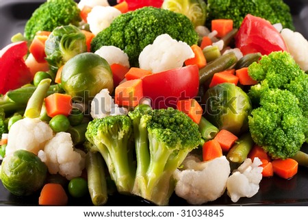 Vegetables: cauliflower, brussels sprouts, broccoli, carrots, string beans  and tomatoes