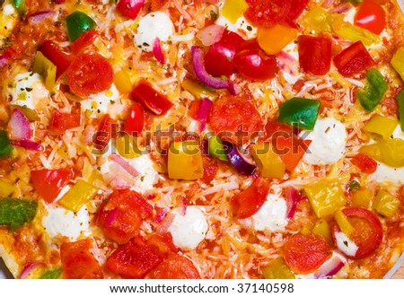 Vegetables pizza close-up. Bright and appetizing stuffing.