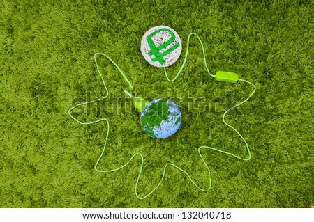 Pumping money from the world. Made of thread balls connected by green wire, on the green carpet.