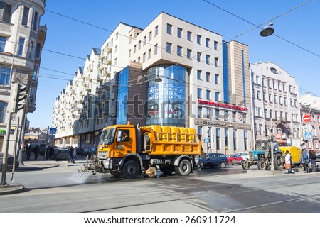 SAINT-PETERSBURG, RUSSIA - MARCH 12: Street-cleaning machine on the Ligovsky prospect. March 12, 2015.
