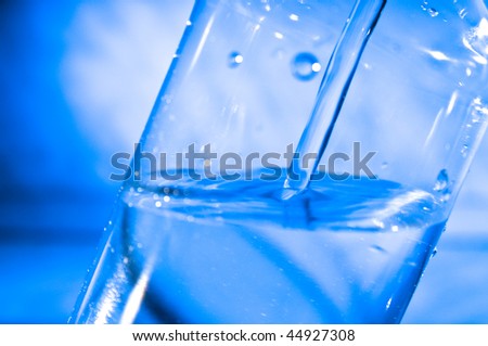 Pure water pouring in the plastic bottle from the water crane