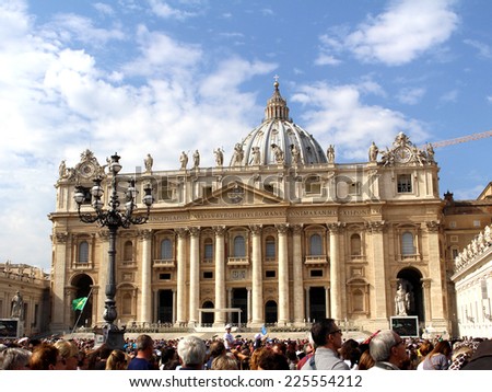 ROME, ITALY - OCTOBER 12 2014: Crowds wait for Popes blessings in the square in front of St Peters church in Rome Italy