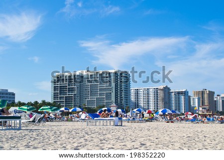 MIAMI, USA - MARCH 30: Unknown people on a beach in Miami. Miami the second-large city in Florida and the biggest megalopolis in the southeast of the USA on March 30, 2014 in Miami, USA