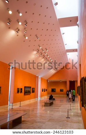 MADRID, SPAIN - AUGUST 26: Visitors in the museum Thyssen-Bornemisza.  The museum remains to one of significant objects in Madrid on August 26, 2014 in Madrid, Spain