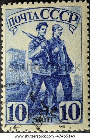 USSR - CIRCA 1941: A Stamp printed in the USSR shows the worker and the working woman, circa 1941