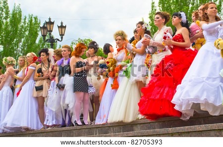 DONETSK, UKRAINE - MAY 15: Parade of brides. Annual action called to draw attention of the public to the social importance of family values and a home. May 15, 2011 in Donetsk, Ukraine