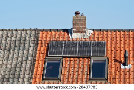 Solar panels on an old fashioned dutch tile roof