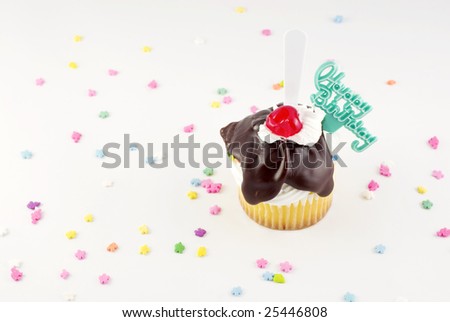 Happy Birthday Sundae Cupcake with fudge topping cherry with Happy Birthday decoration  copy space