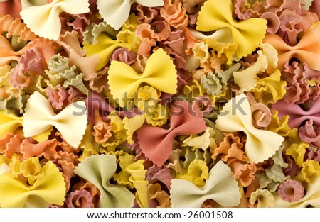 Colorful bow and spiral shaped vegetable pasta macro