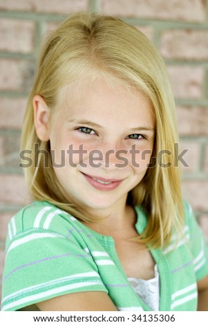 stock photo : Cute smiling boy with blonde hair and green eyes,