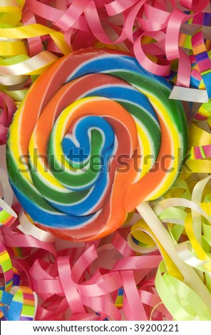 A colorful birthday sucker with birthday ribbons, full frame background, vertical