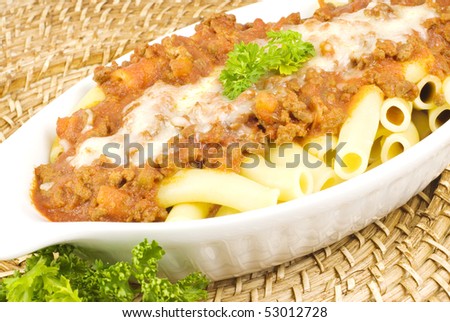Baked Pasta with meat sauce topping with Mozzarella cheese with copy space