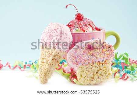 A cherry ice cream sundae in a decorative dish with crispy cereal treats