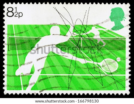 UNITED KINGDOM - CIRCA 1977: A used postage stamp printed in Britain celebrating Racket Sports showing Lawn Tennis, circa 1977