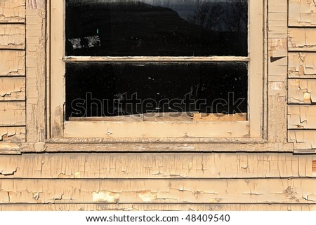 old window and cracking paint on siding details