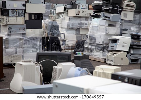FAIRFAX, VA - DECEMBER 5: Many computers and printers to be recycled stacked at a dumpster on December 5, 2013 in Fairfax, VA. Components, plastic and metal will be separated and melted.