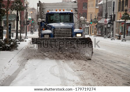 WASHINGTON, DC - FEBRUARY 3: Winter storm of the Mid Atlantic on February 3, 2014 in Washington, DC. Truck plowing Wisconsin Ave. in Georgetown. The government, stores and companies where closed.