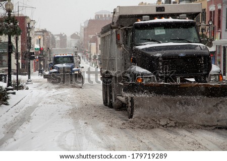 WASHINGTON, DC - FEBRUARY 3: Winter storm of the Mid Atlantic on February 3, 2014 in Washington, DC. Trucks plowing Wisconsin Ave. in Georgetown. The government, stores and companies where closed.