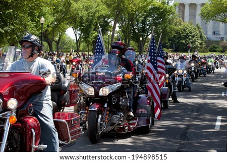 WASHINGTON, DC - MAY 25: Motorcycles travel in DC as part of the annual Rolling Thunder motorcycle Ride for Freedom for American POWs and MIA soldiers on May 25, 2014 in Washington, DC.