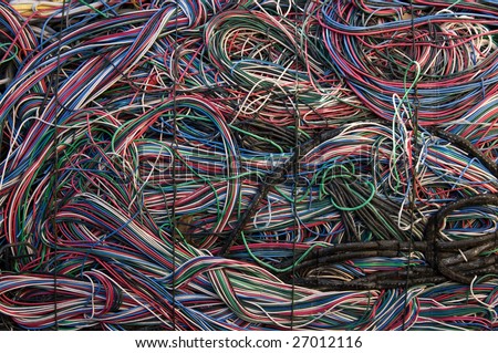 A bale of communication cables. There is a mix of plastic and copper to recover.
