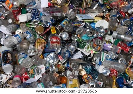 BALTIMORE - CIRCA 2008: Aluminum cans and plastic bottles lie in a heap at an undisclosed recycling facility to be sorted, circa 2008 in Baltimore. The cans and bottles will be compressed and baled.