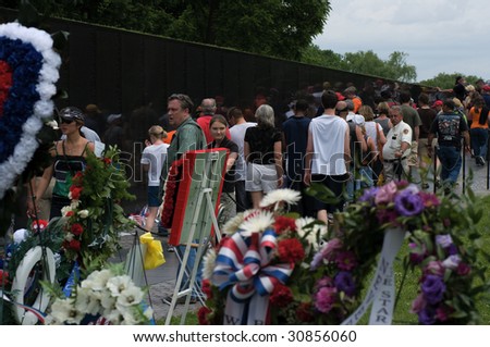WASHINGTON, DC - MAY 24 : Riders visit the Vietnam War Memorial at the annual Rolling Thunder rally \