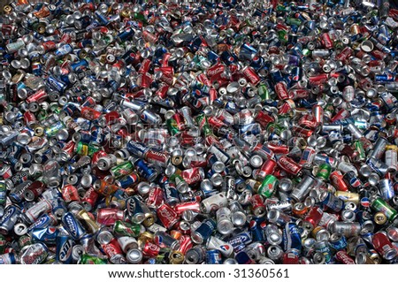 RICHMOND, VA - CIRCA 2009: Aluminum cans lie in a heap at an undisclosed recycling facility circa 2009 in Richmond. The cans will be compressed and baled.