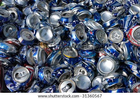 RICHMOND, VA - CIRCA 2009: Crushed aluminum cans lie in a heap at an undisclosed recycling facility circa 2009 in Richmond. The cans will be shipped to an aluminum foundry.