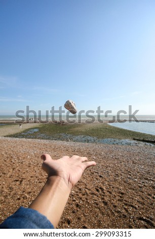 Man throwing a rock away