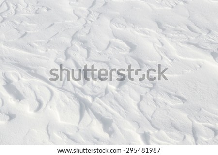 Fresh snow background - windswept, abstract, sculpted, soft snow texture