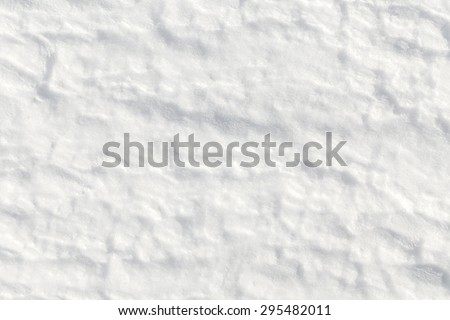 Fresh snow background - packed, wind blown, pattern close-up