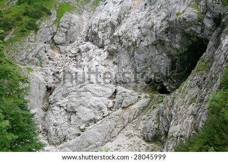 Group of people climbing a mountain near Zugspitze, Garmisch, in a steep path