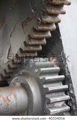 two cogwheels on rusted antique machine