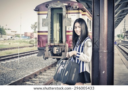 Beautiful Woman on the train.Traveling concept.Travel by Train.Young woman traveling by train