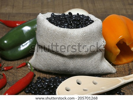 black beans with raw canvas bags.